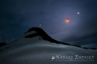 "Earthly Visions" - The "blood moon" over Soda Butte Cone, a large, dormant hot spring in Lamar Valley. 